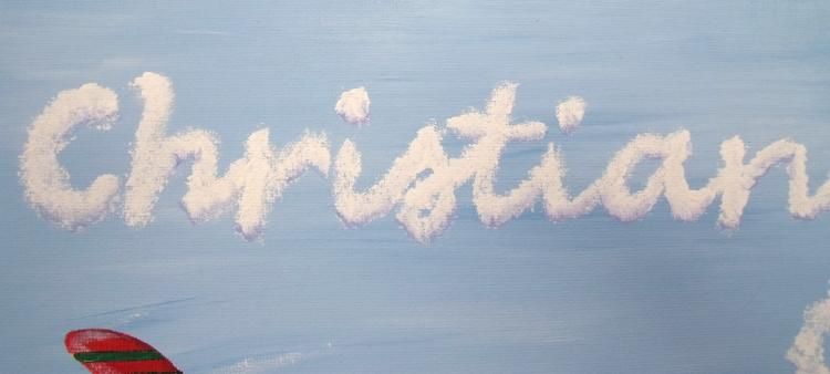   sky blue background with childs name written in puffy sky writer