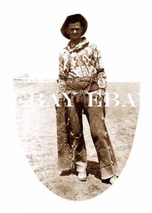 PHOTO OF A COWBOY WEARING FANCY SHIRT AND LEATHER CHAPS  